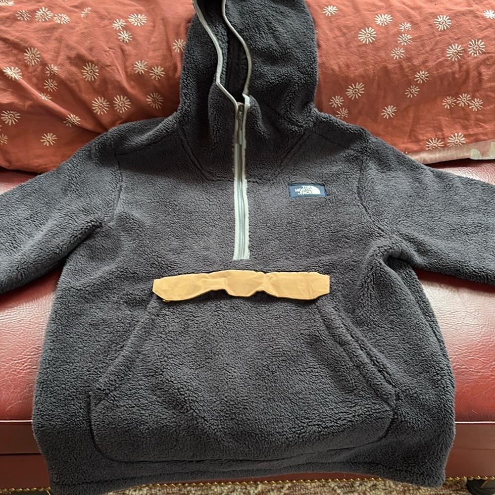 Northface fleece pullover hoodie with pockets and zipper.